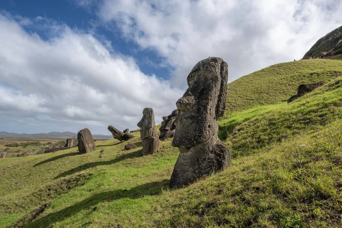 Moai statues on a grassy hillside at Rano Raraku, Rapa Nui (Easter Island), Chile